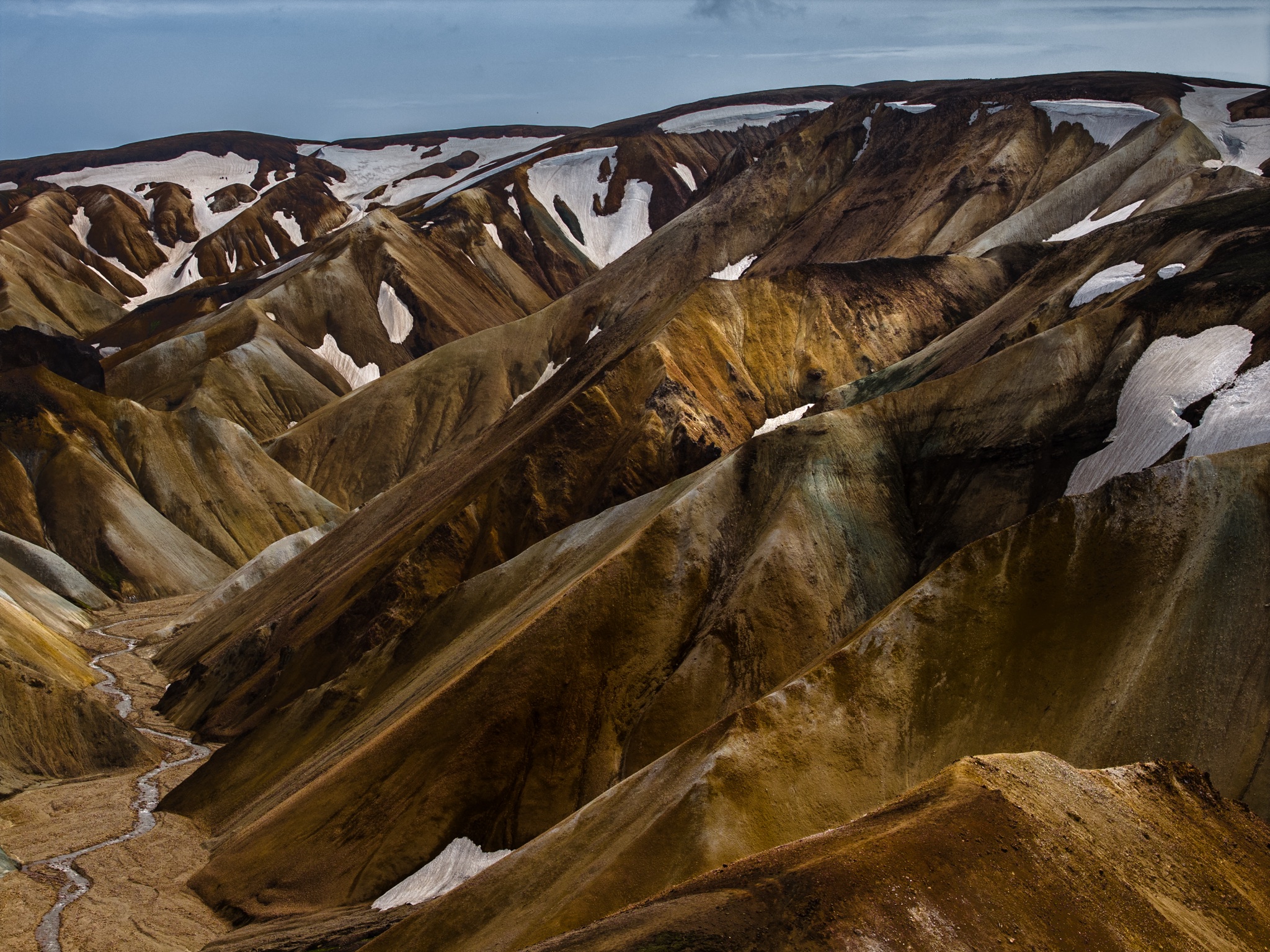 Rhyolite ridges in dappled light