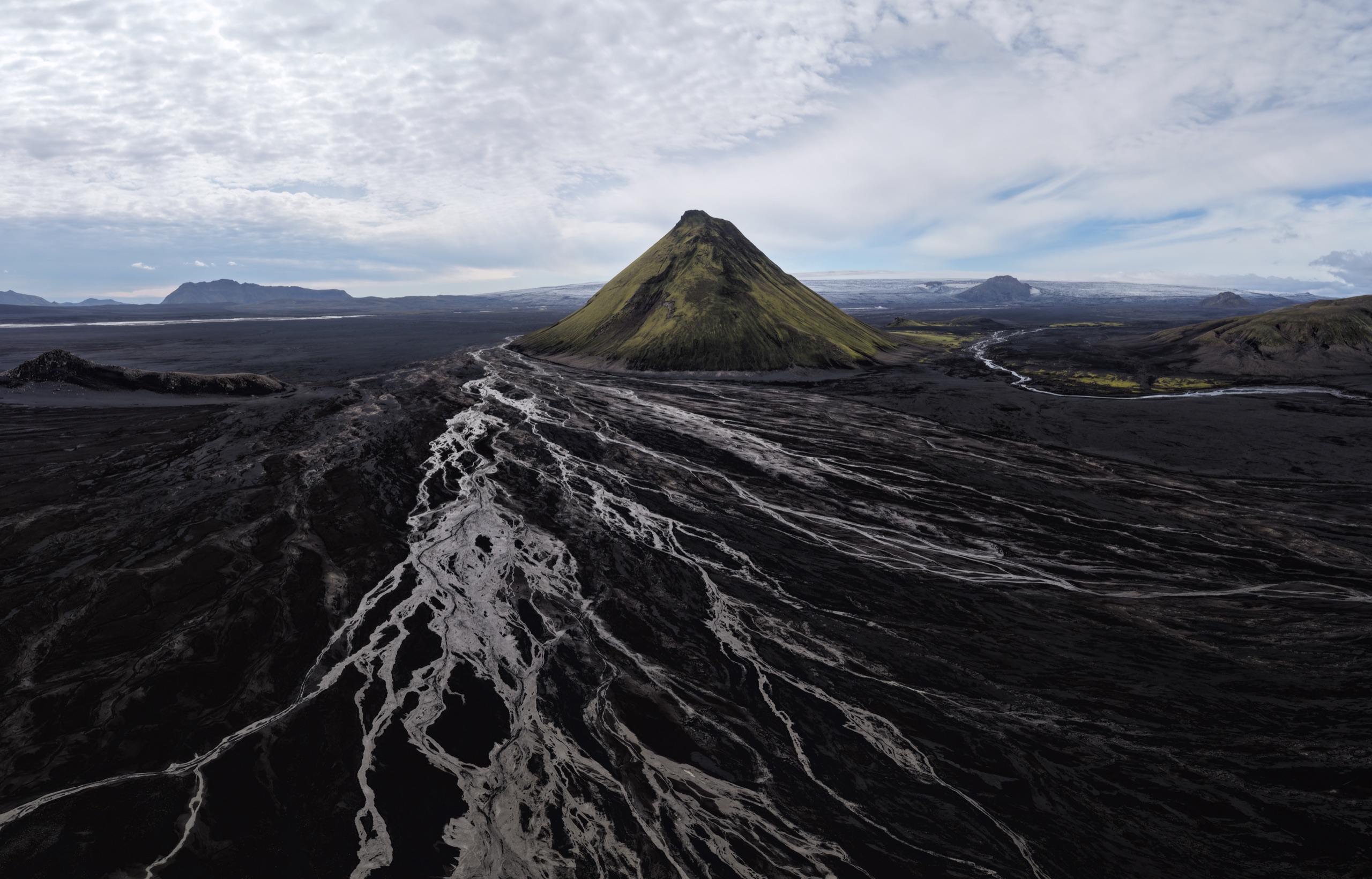 Mælifell rising from the black volcanic sands